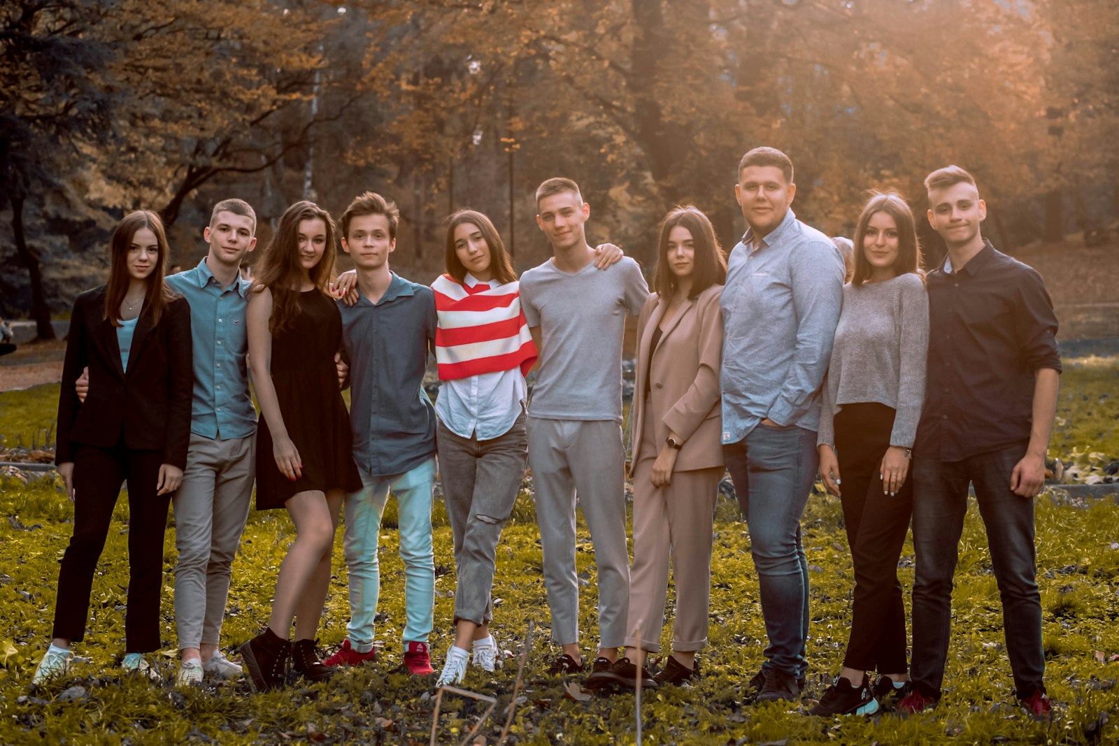 group of people standing on green grass field during daytime representing blended families